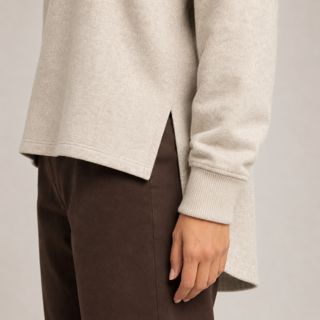 Oatmeal beige sweatshirt high-low side-slit construction detail